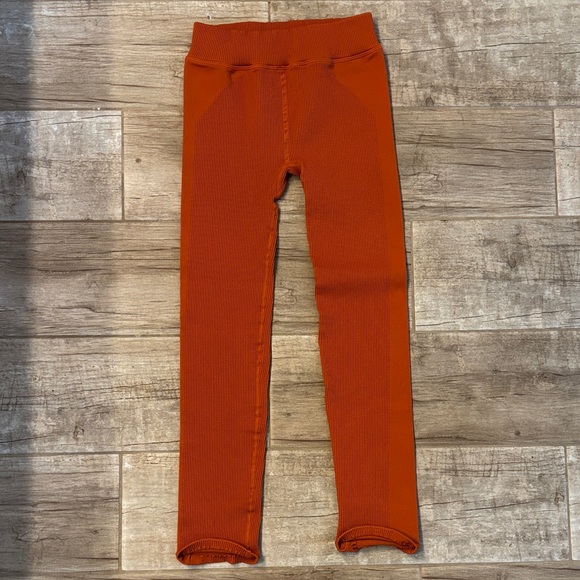 free people movement Pants - Free People Movement Happiness Runs ribbed leggings in a bright orange color.